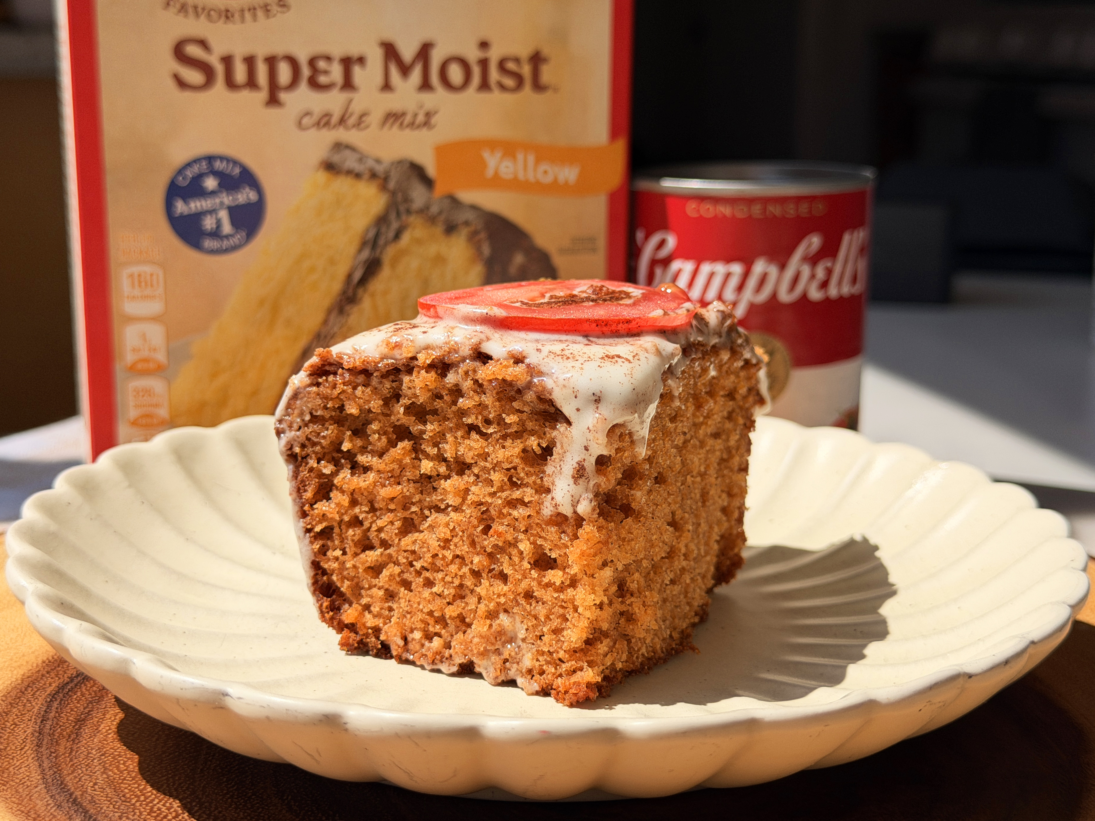 A slice of moist Tomato Soup Cake with cream cheese frosting