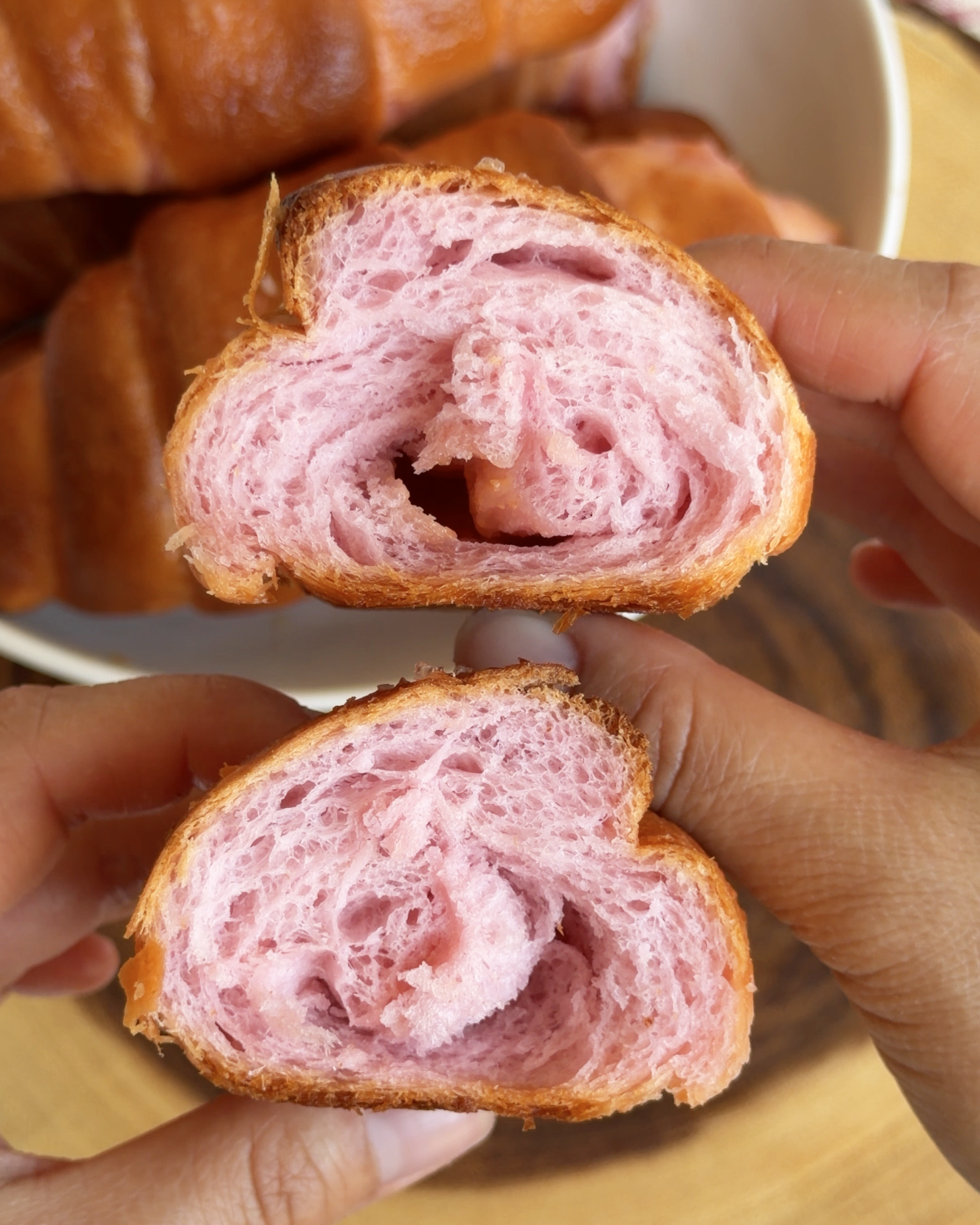 Cross section of guava salt bread showing the buttery center and pink crumb